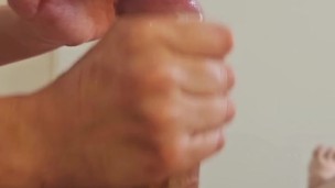 I find my stepbrother in bed and help him exercise his penis with a handjob.